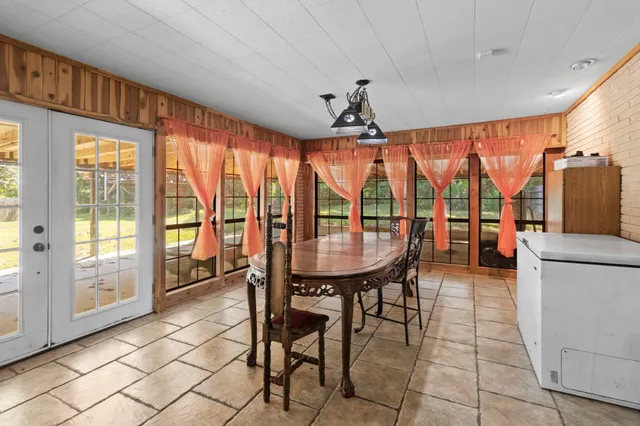 a view of a dining room with furniture window and outside view