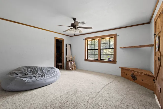 a view of workspace with window and ceiling fan