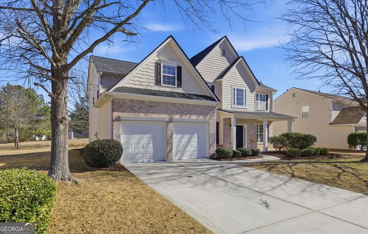 6563 Brandemere Way Southwest Austell, GA 30168 - Photo 1 of 1 a front view of a house with a yard