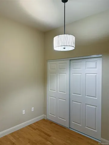 a view of a chandelier fan and entryway