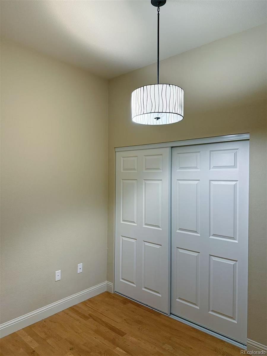 5401 South Park Terrace Avenue, Unit 105C Greenwood Village, CO 80111 - Photo 8 of 14 a view of a chandelier fan and entryway