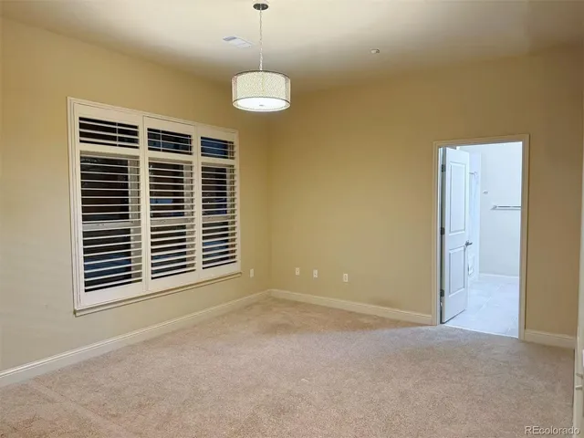 a view of empty room with windows