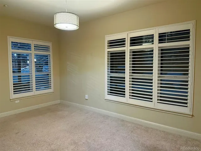 a view of empty room with a large window