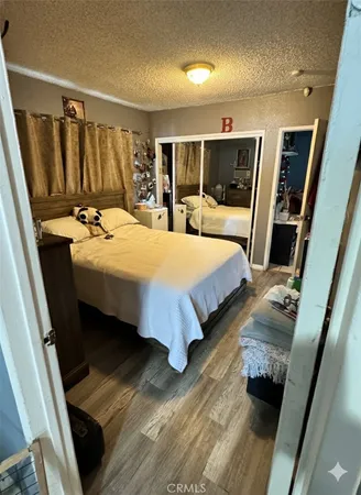 a bedroom with double bed and a large mirror