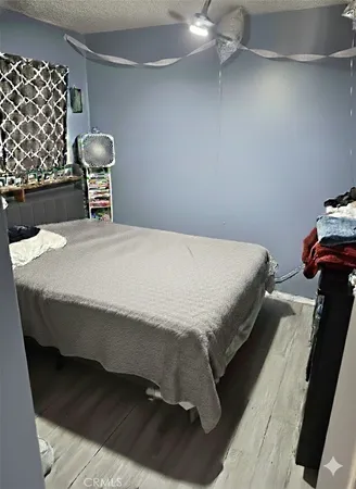 a bedroom with a bed and dresser