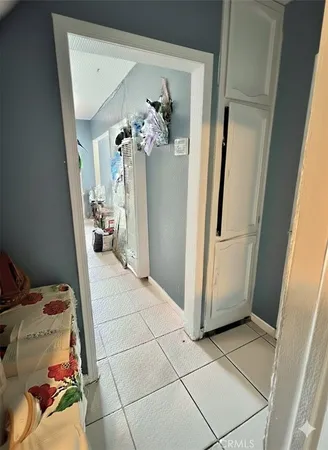 a view of bathroom with a sink and mirror