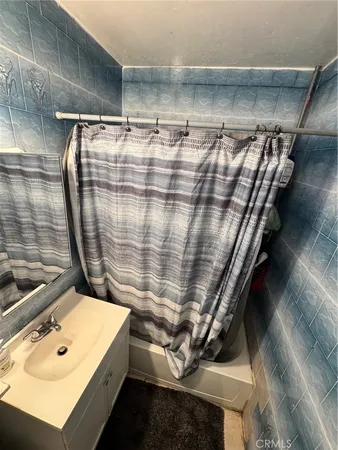 a bathroom with a sink and a shower