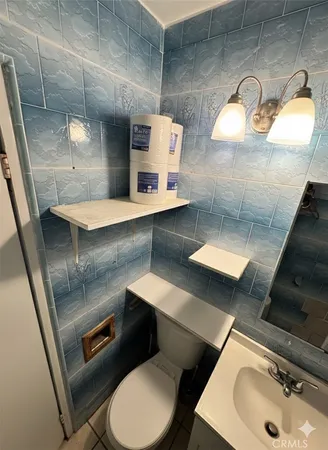 a bathroom with a toilet and a sink