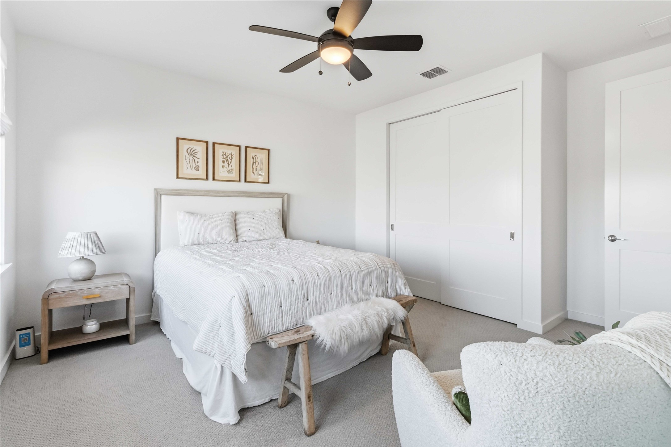 410 Kayak Way Austin, TX 78738 - Photo 23 of 39 Bedroom featuring carpet floors, a closet, and a ceiling fan