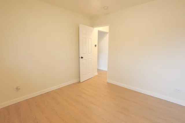 a white bath tub sitting next to a white toilet and sink