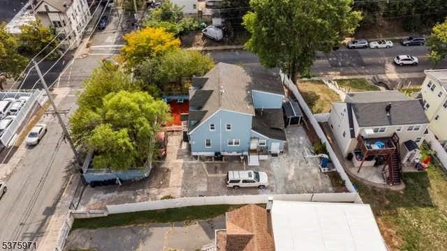 an aerial view of house with yard swimming pool and outdoor seating