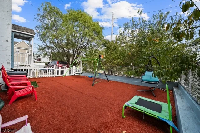 a wooden bench sitting in front of a building