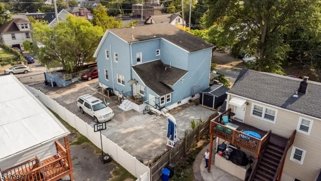 an aerial view of a house with outdoor space