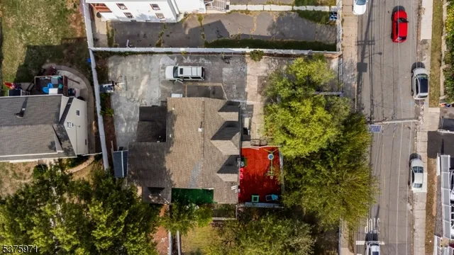 an aerial view of a house with outdoor space