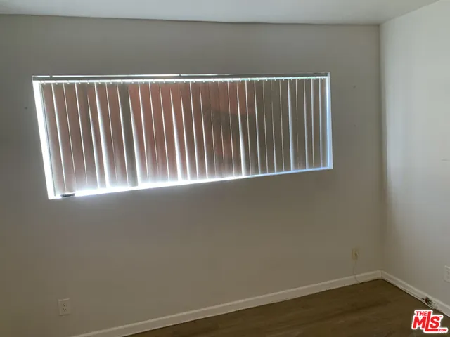 a bathroom with a mirror and a glass door shower