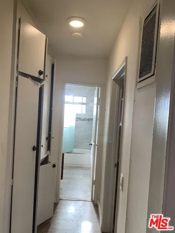 an empty room with wooden floor