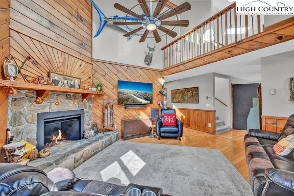 a bedroom with furniture and a fireplace