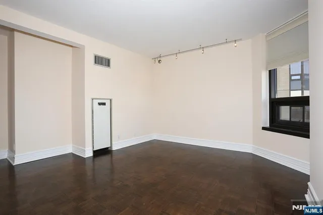 a bathroom with a tub sink shower and mirror