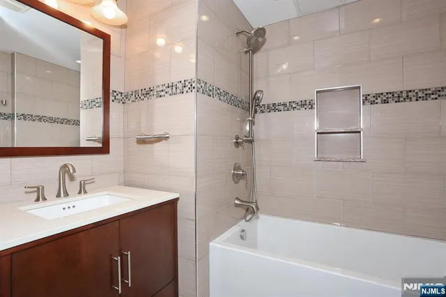 a bathroom with a shower and a tub