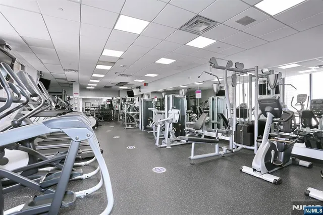 a living room with fireplace furniture and a flat screen tv