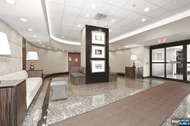 a view of a lake with a yard and outdoor seating