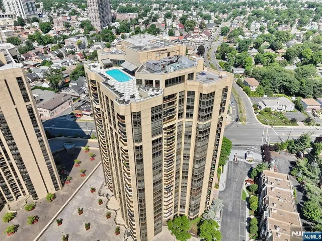 a view of a patio with table and chairs