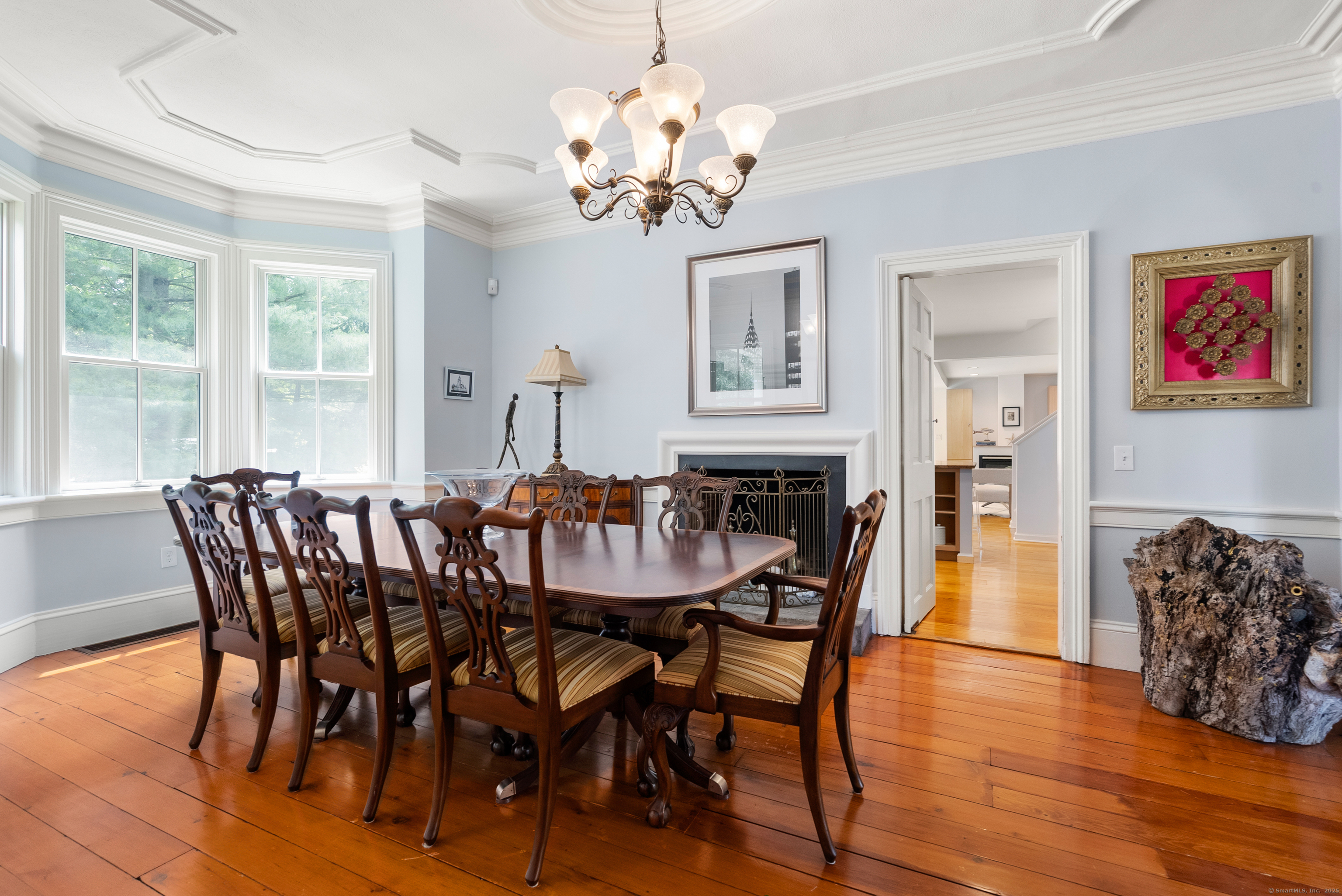 18 Bridge Street Westport, CT 06880 - Photo 13 of 36 a view of a dining room with furniture wooden floor and chandelier