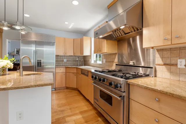 a kitchen with a stove and a sink