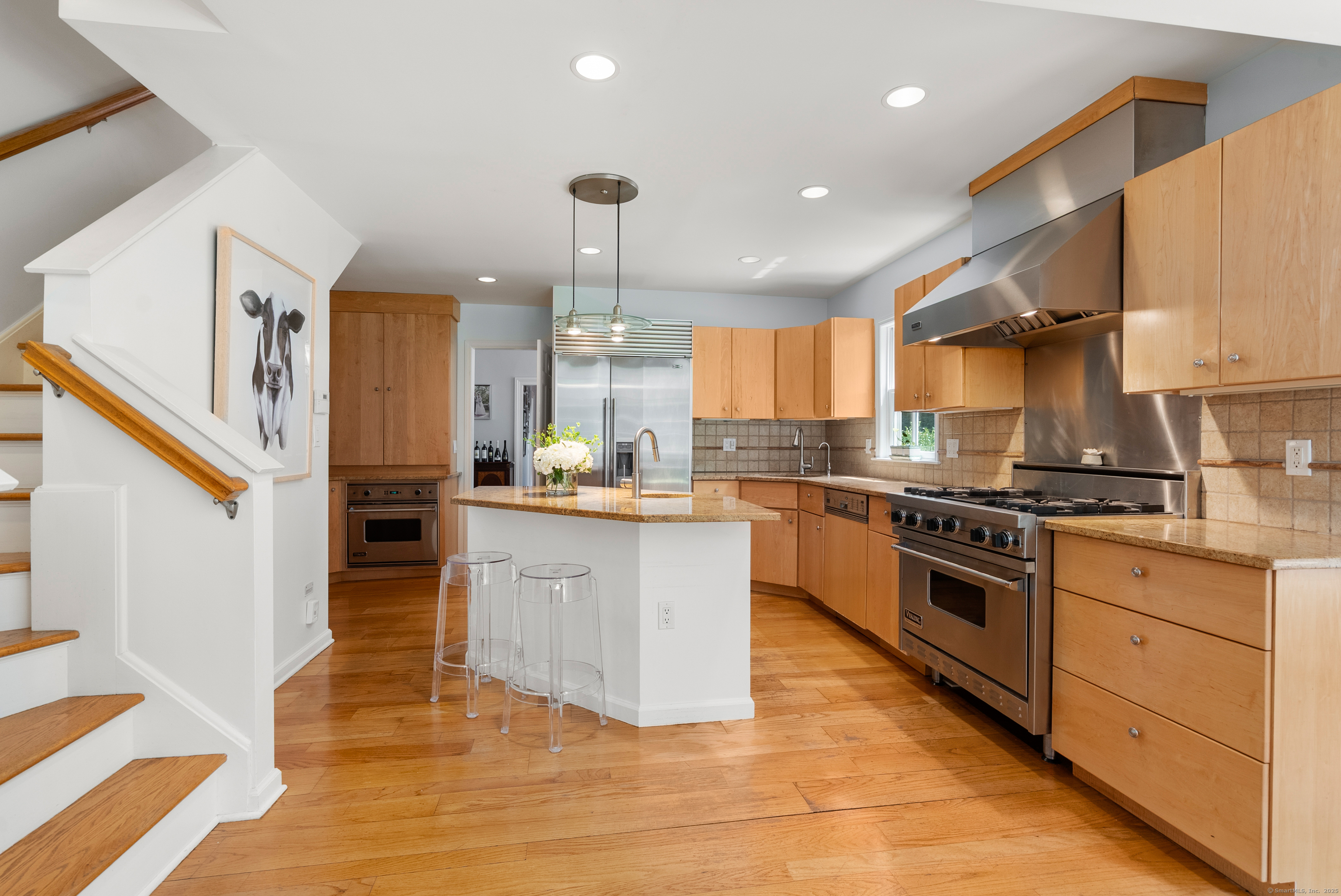 18 Bridge Street Westport, CT 06880 - Photo 18 of 36 a kitchen with stainless steel appliances granite countertop a stove a sink and a refrigerator