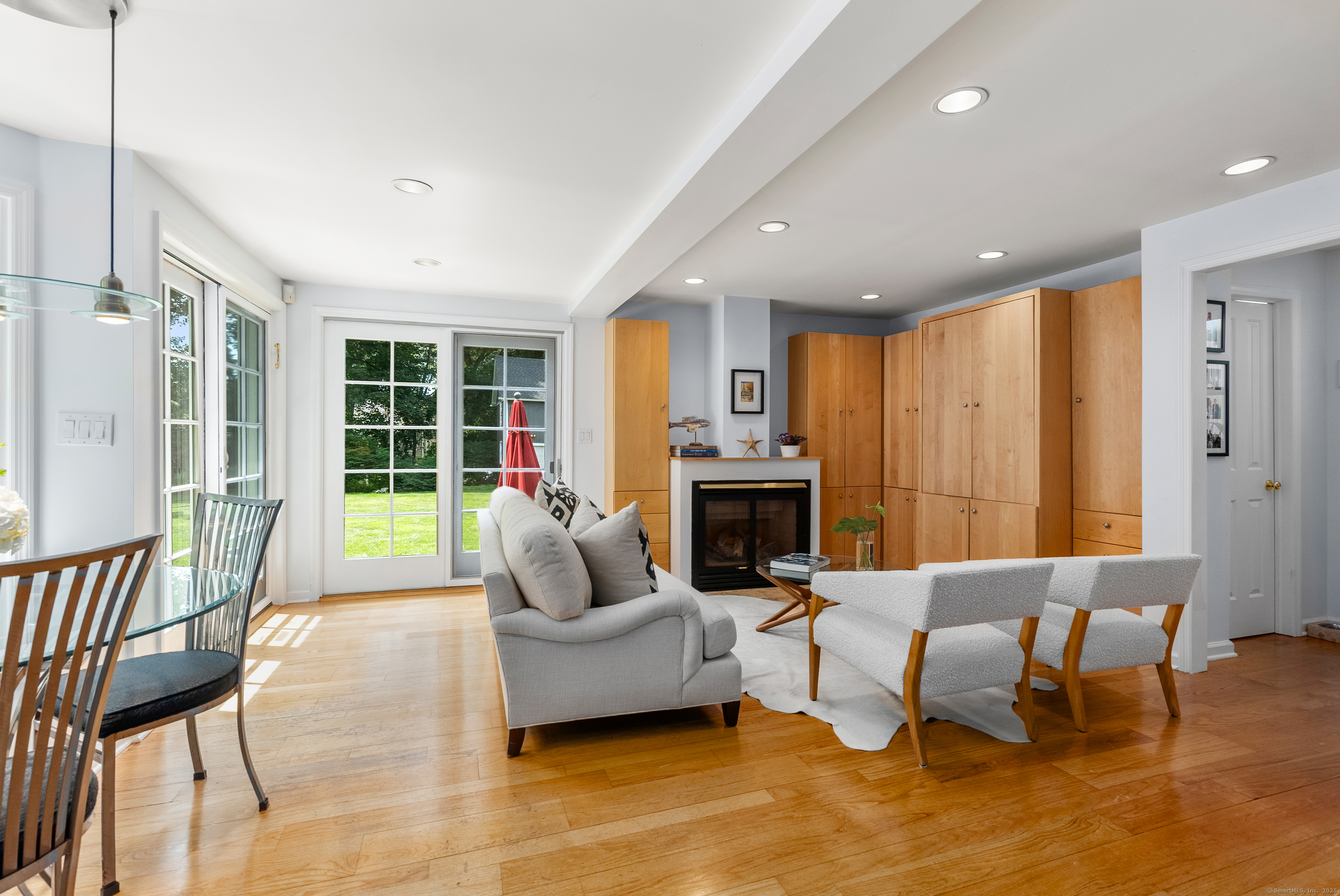 18 Bridge Street Westport, CT 06880 - Photo 21 of 36 a living room with furniture or outdoor view and a fireplace