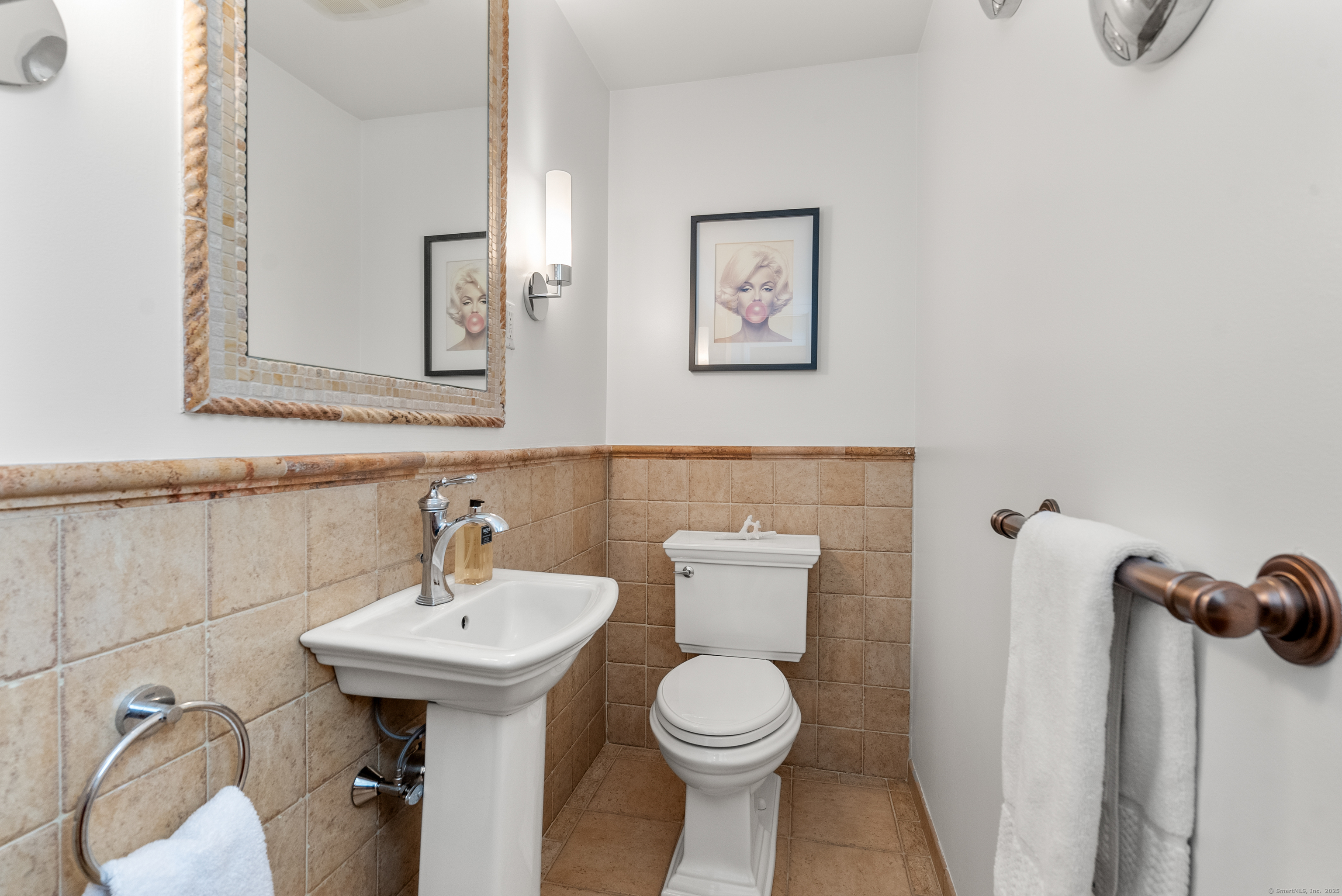 18 Bridge Street Westport, CT 06880 - Photo 24 of 36 a bathroom with a sink mirror and toilet