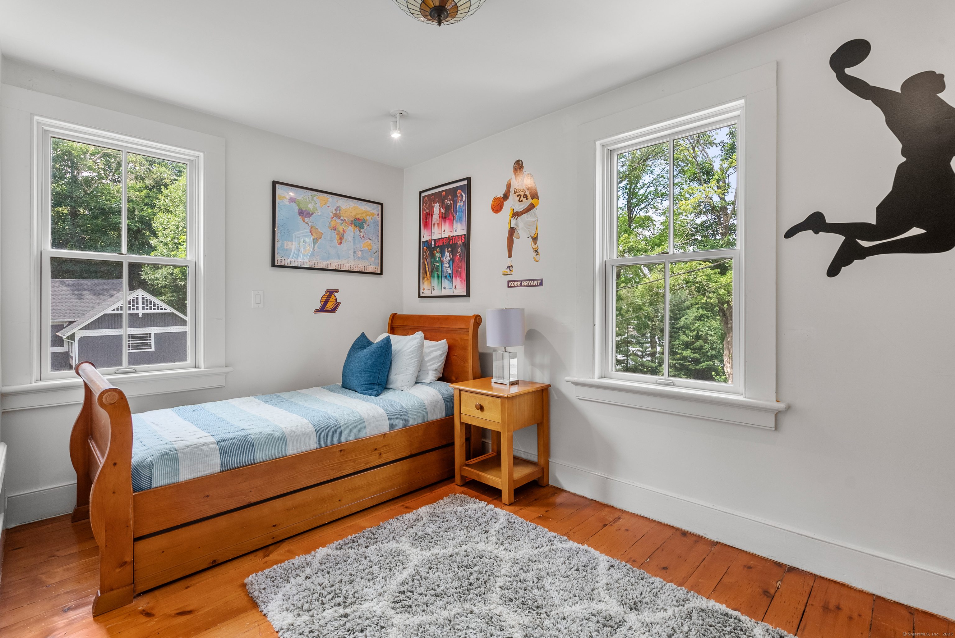 18 Bridge Street Westport, CT 06880 - Photo 26 of 36 a bedroom with a bed and a window