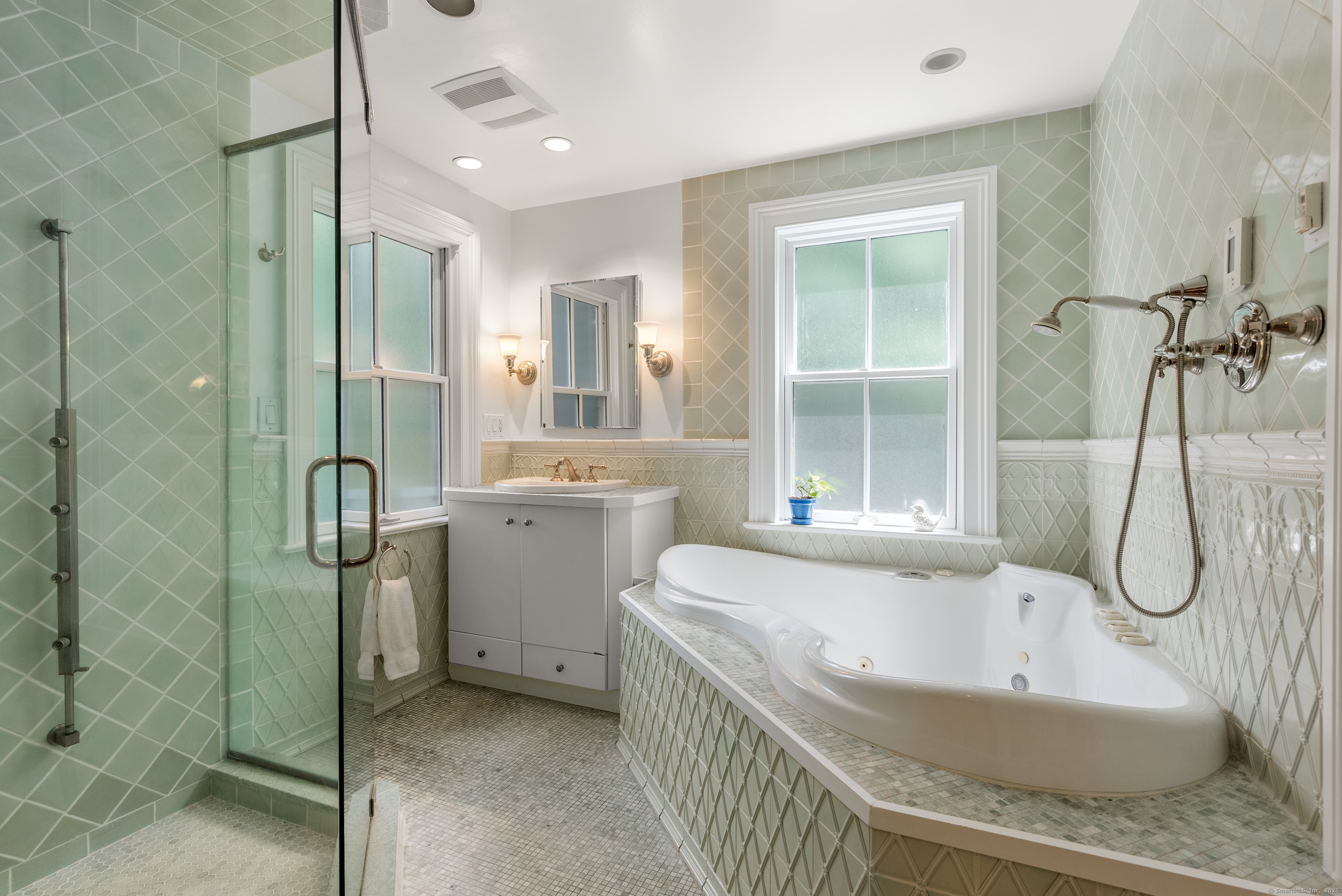 18 Bridge Street Westport, CT 06880 - Photo 29 of 36 a bathroom with a granite countertop sink and mirror