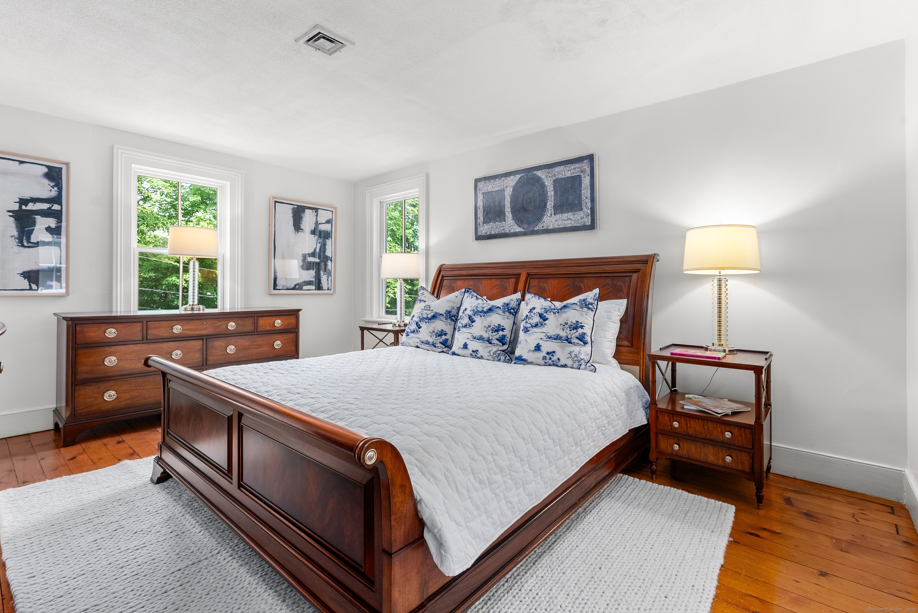 18 Bridge Street Westport, CT 06880 - Photo 31 of 36 a bed room with a bed and a night stand