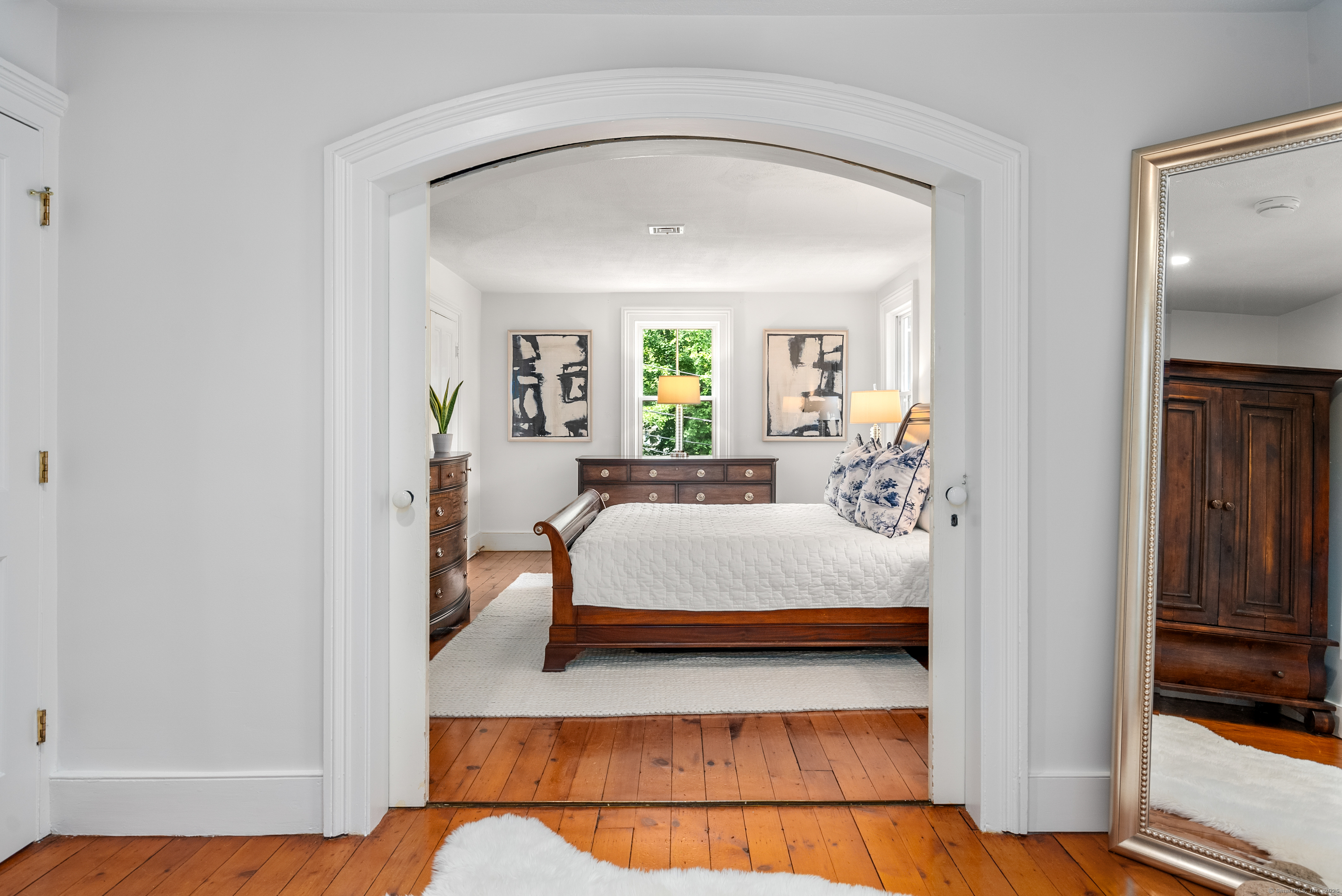 18 Bridge Street Westport, CT 06880 - Photo 33 of 36 a bedroom with a bed and a window