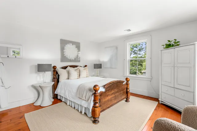 a bed room with a bed and a window