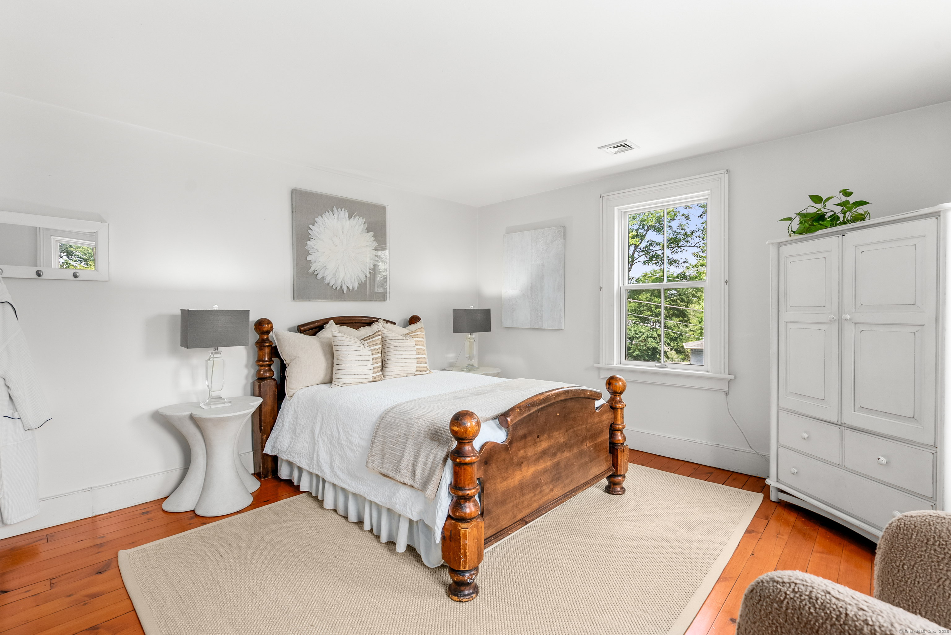 18 Bridge Street Westport, CT 06880 - Photo 35 of 36 a bed room with a bed and a window