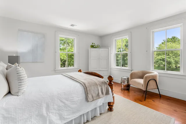 a bedroom with a bed and a couch