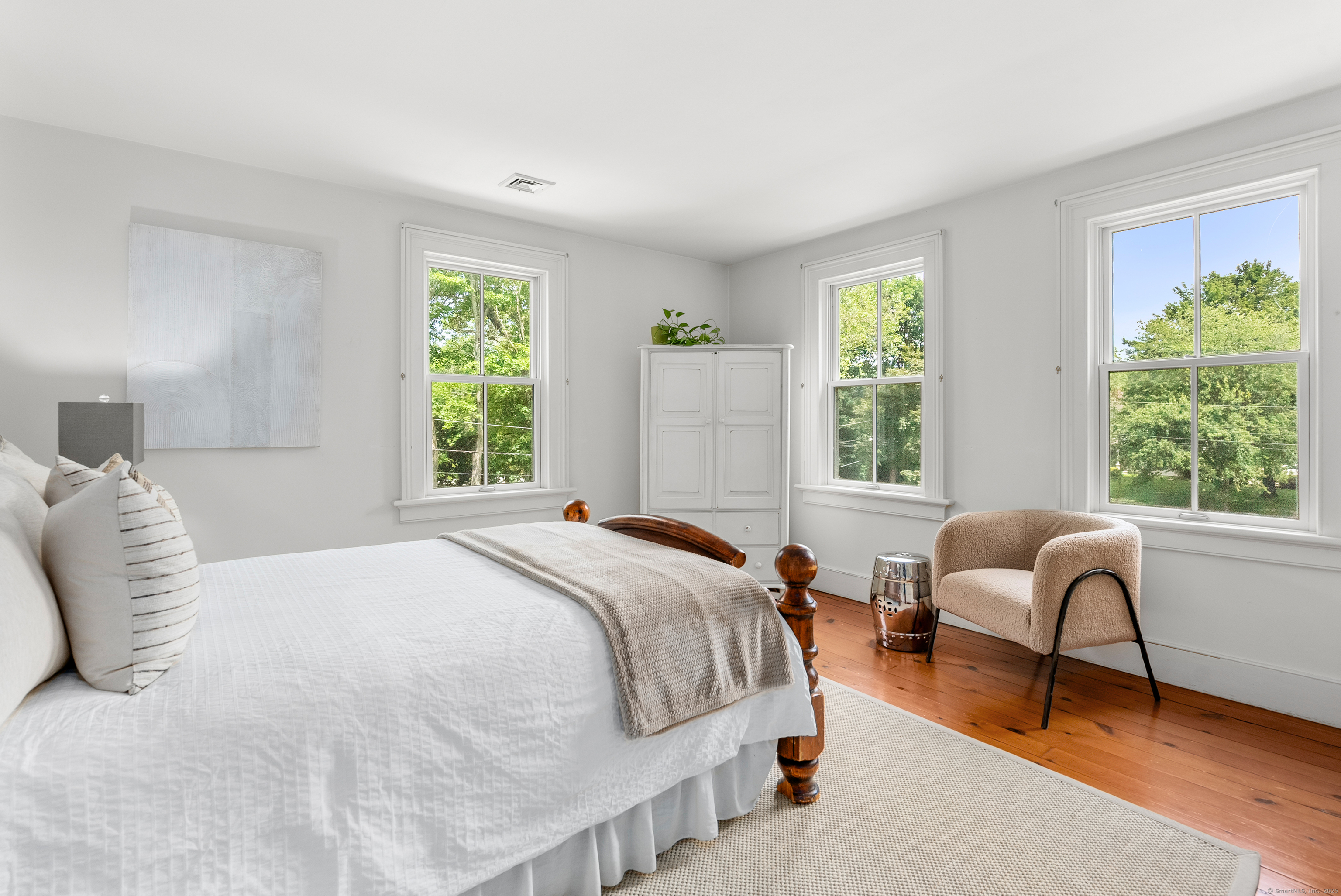 18 Bridge Street Westport, CT 06880 - Photo 36 of 36 a bedroom with a bed and a couch