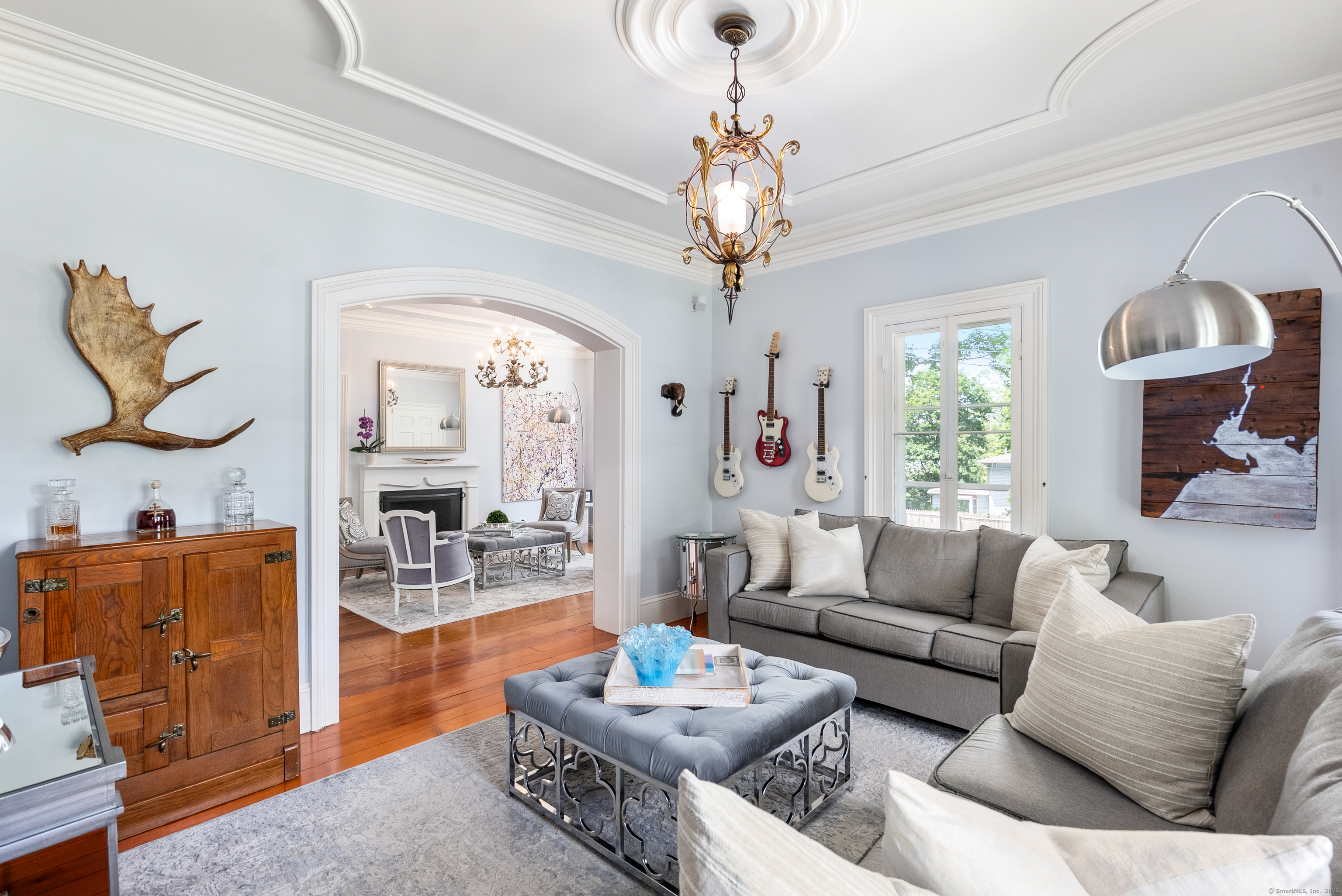 18 Bridge Street Westport, CT 06880 - Photo 6 of 36 a living room with furniture a chandelier and a mirror