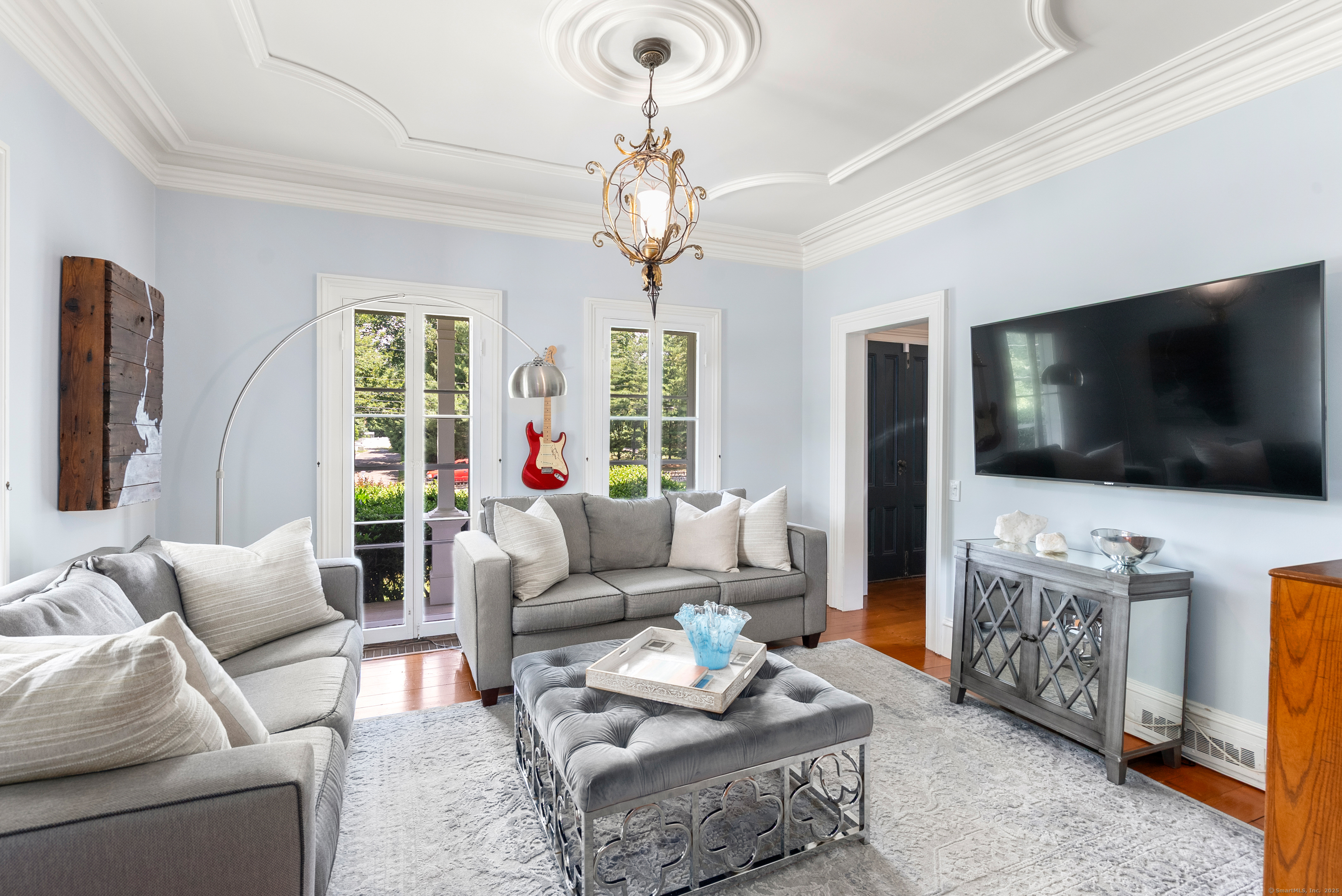 18 Bridge Street Westport, CT 06880 - Photo 7 of 36 a living room with furniture and a flat screen tv