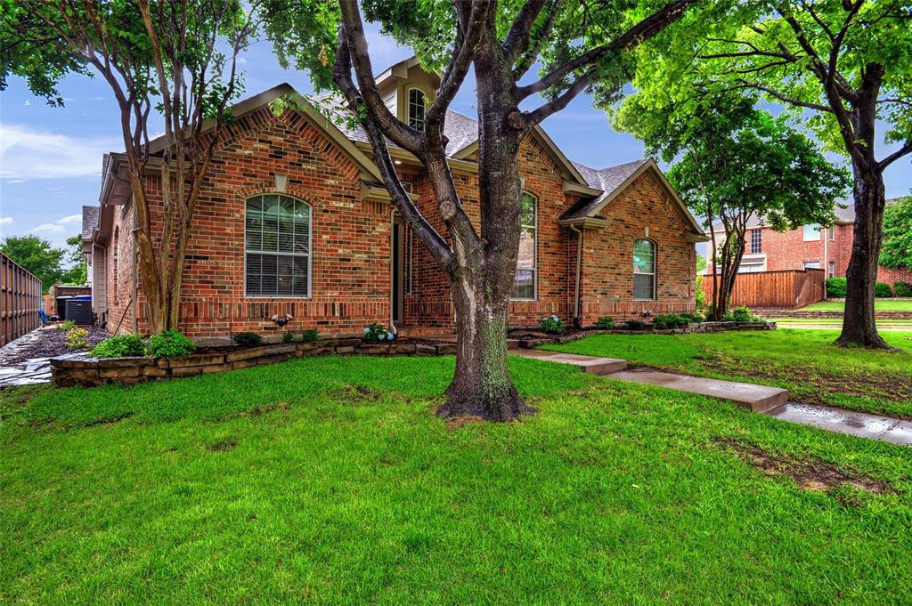 6899 Branch Trail Frisco, TX 75035 - Photo 1 of 1 a front view of house with yard and green space