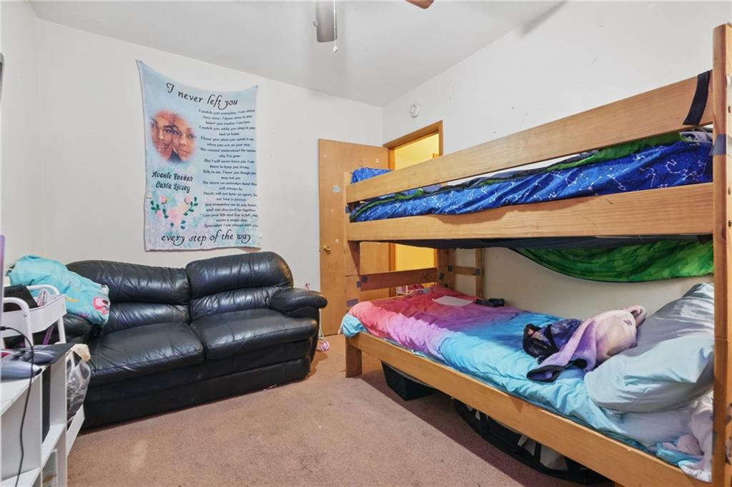 43 Orchard Street McKees Rocks, PA 15136 - Photo 13 of 18 a bedroom with a bed couch and a window