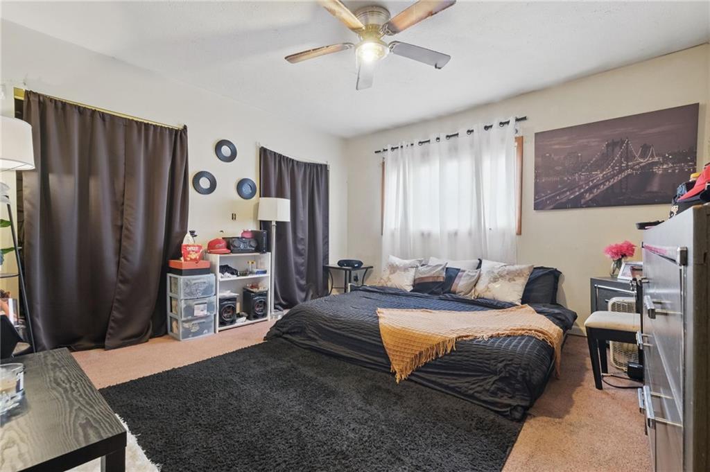 43 Orchard Street McKees Rocks, PA 15136 - Photo 15 of 18 a bedroom with a bed and a window