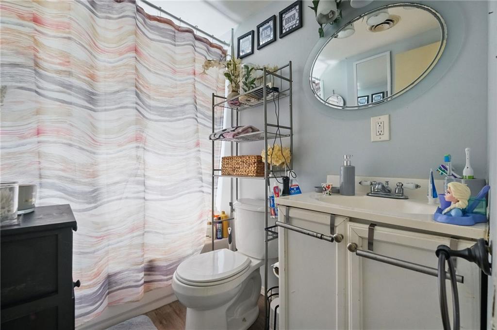 43 Orchard Street McKees Rocks, PA 15136 - Photo 10 of 18 a bathroom with a sink mirror vanity and toilet