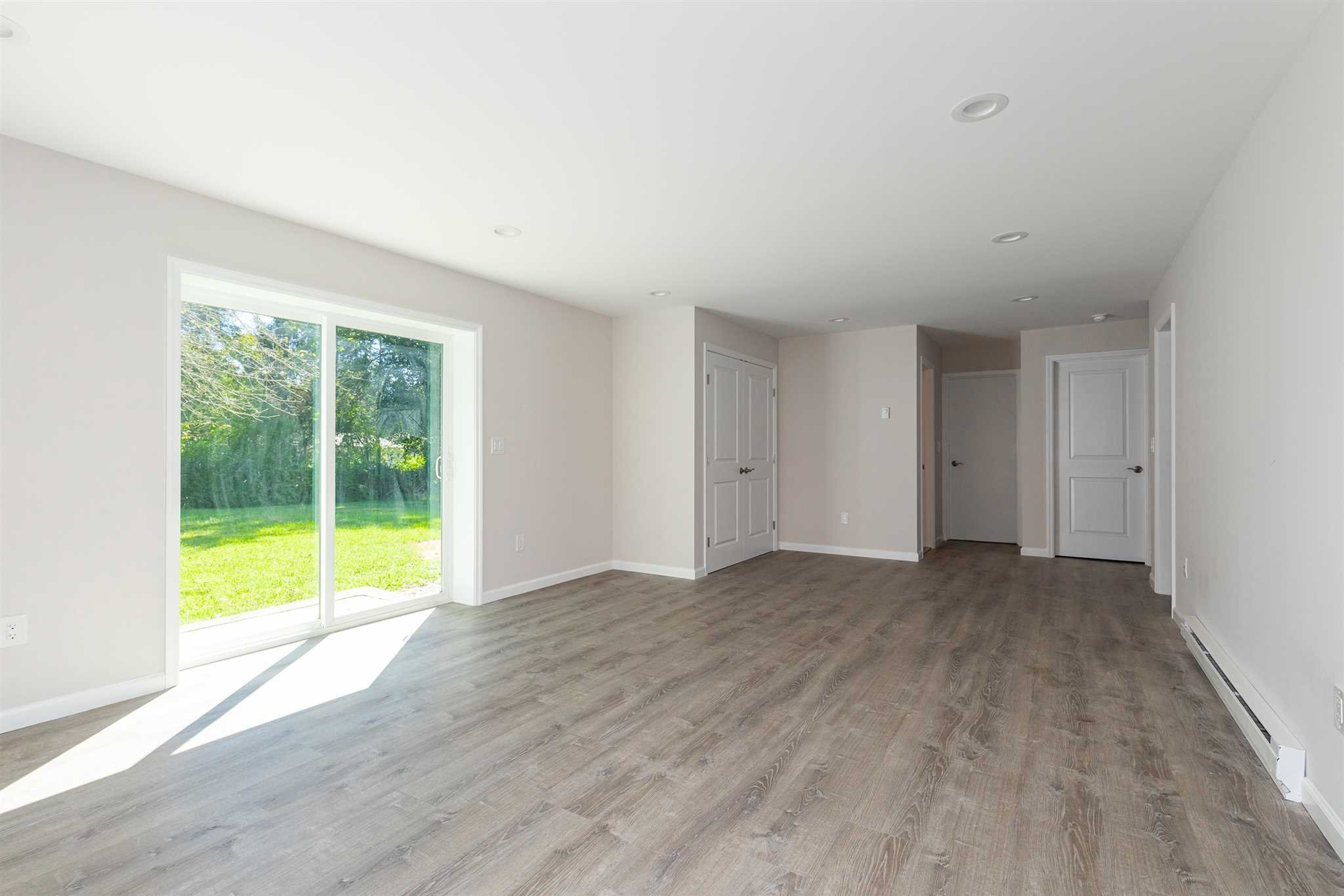 9 Manor Way Poughkeepsie, NY 12603 - Photo 13 of 23 a view of an empty room with wooden floor and a window