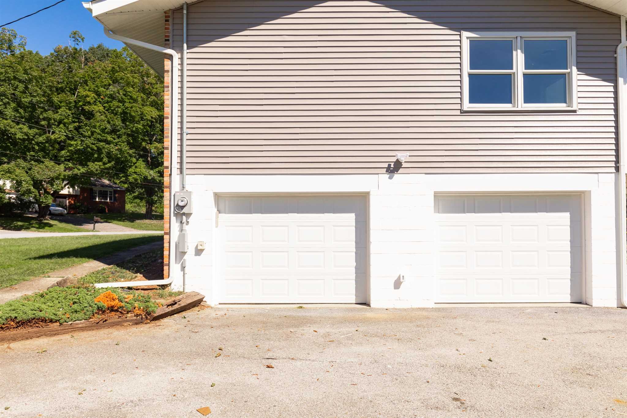 9 Manor Way Poughkeepsie, NY 12603 - Photo 19 of 23 a view of a house with a yard and garage