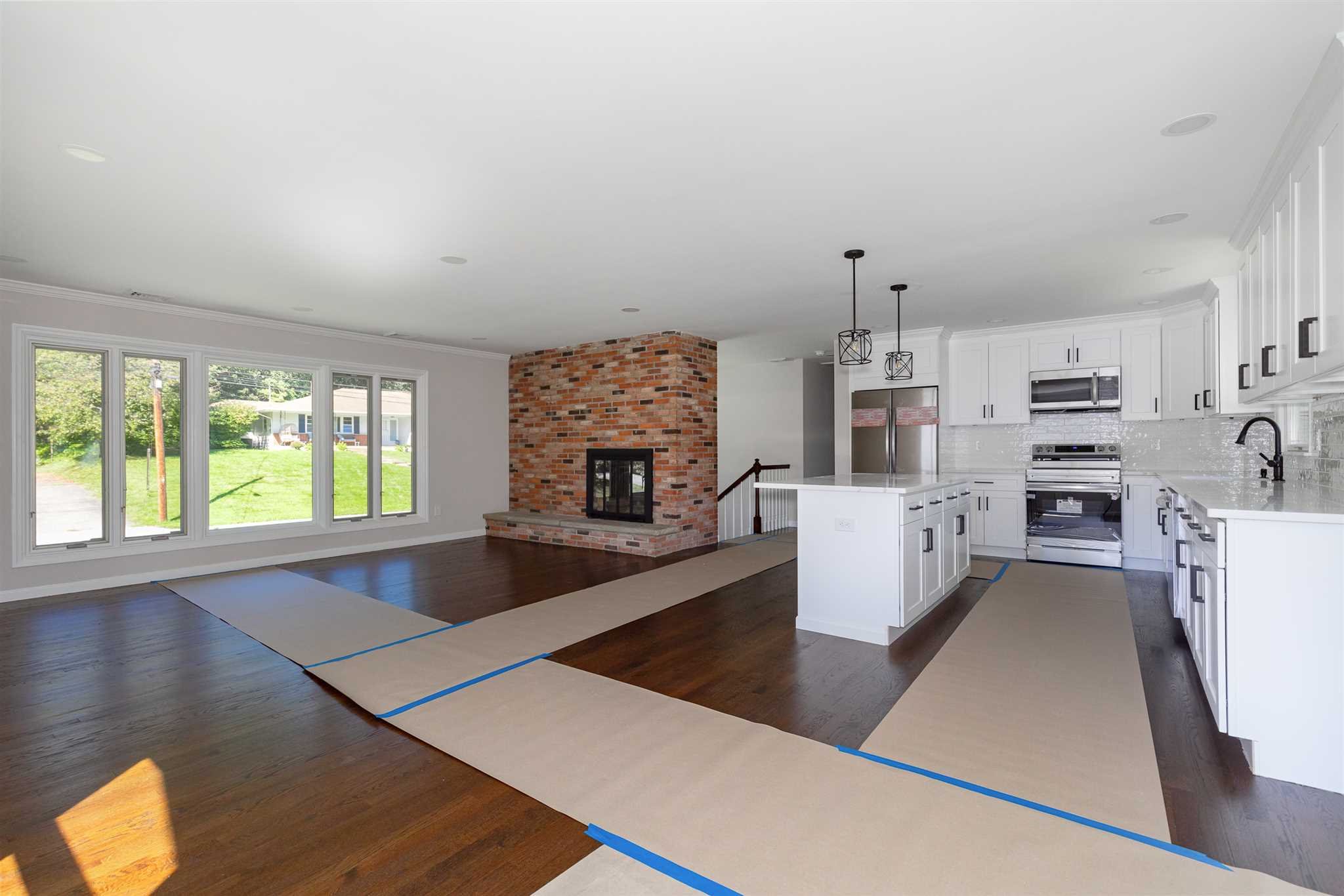 9 Manor Way Poughkeepsie, NY 12603 - Photo 2 of 23 a living room with furniture and a fireplace