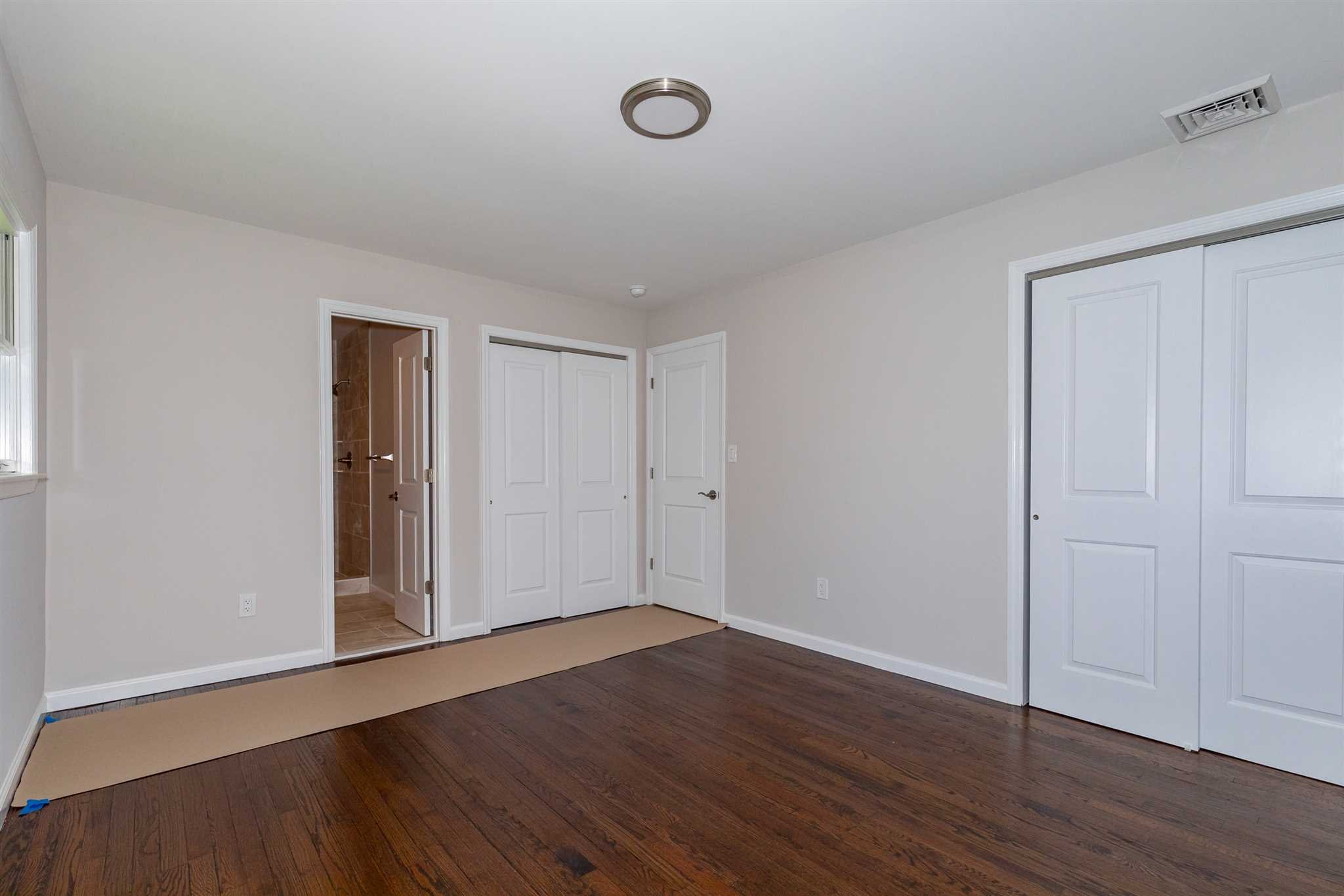 9 Manor Way Poughkeepsie, NY 12603 - Photo 7 of 23 a view of an empty room with wooden floor