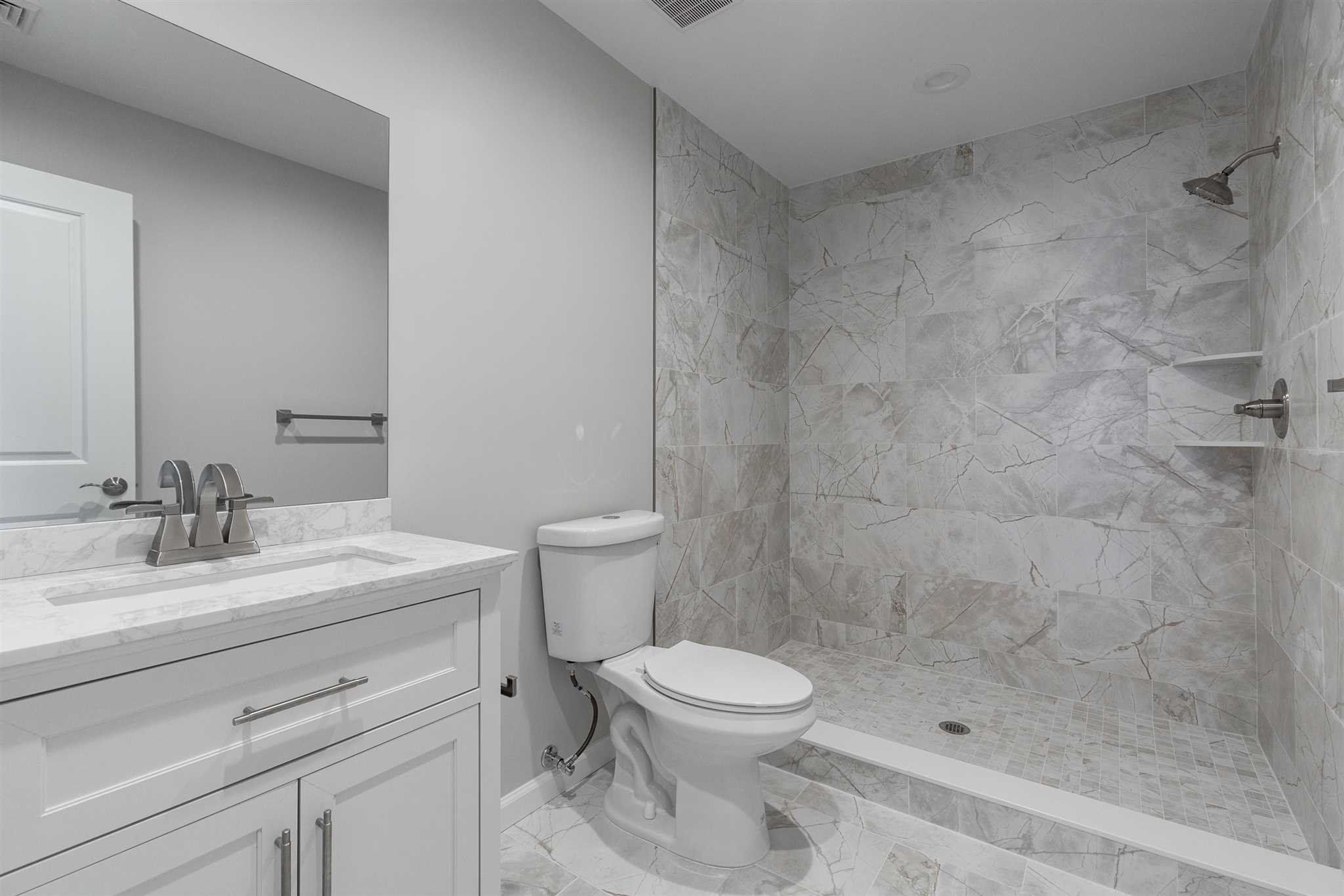 9 Manor Way Poughkeepsie, NY 12603 - Photo 8 of 23 a bathroom with a sink a toilet and shower